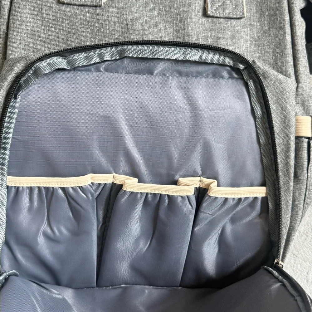 Gray Baby Backpack/Diaper Bag with fold out portable bassinet